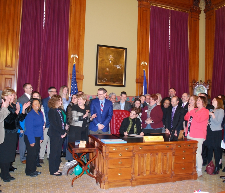 Leadership dubuque team photo clapping