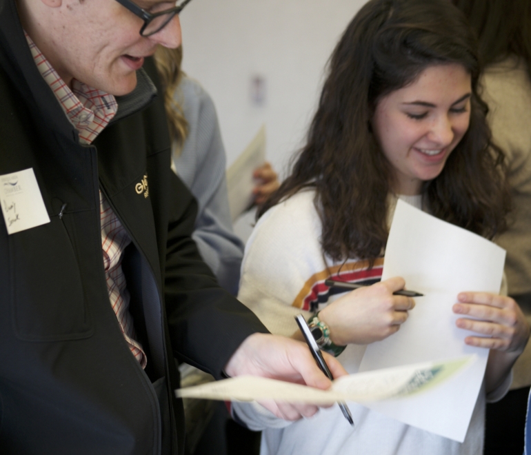 two people working on a document
