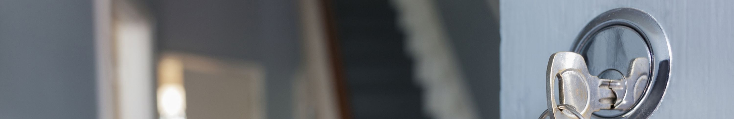 house keys opening door